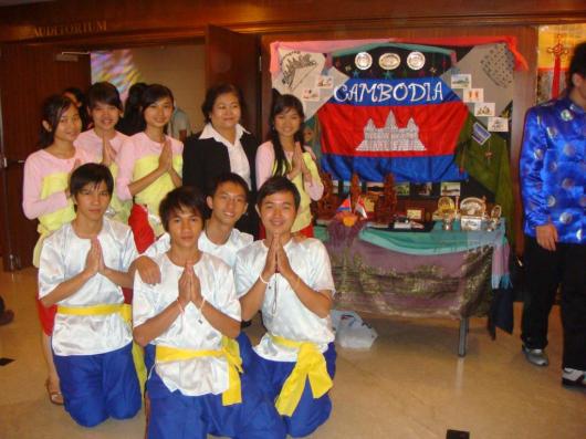 Cambodian group in coconut dance clothes + a cambodian visitor in Singapore